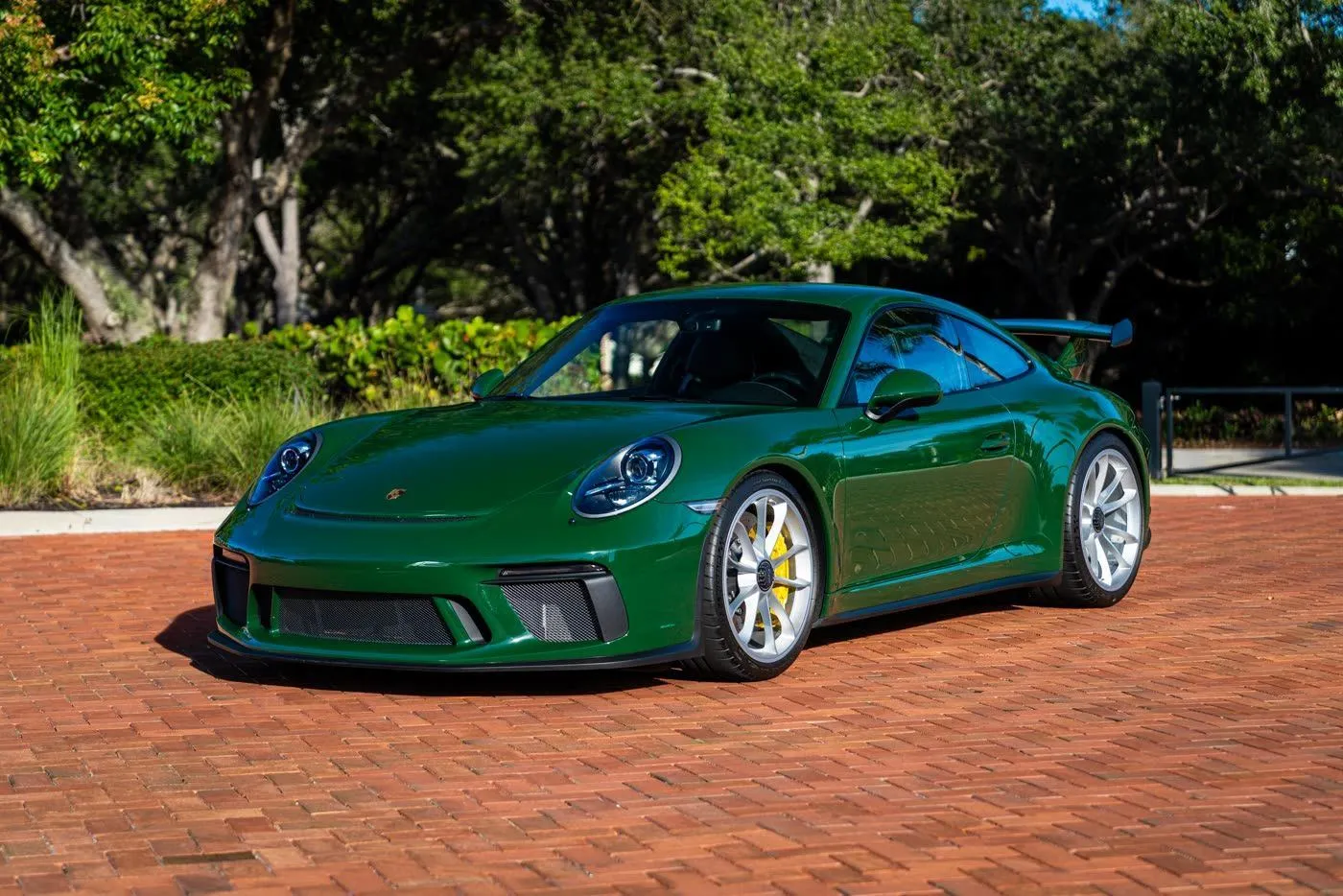 Green 2018 Porsche 911 GT3 on brick pavers